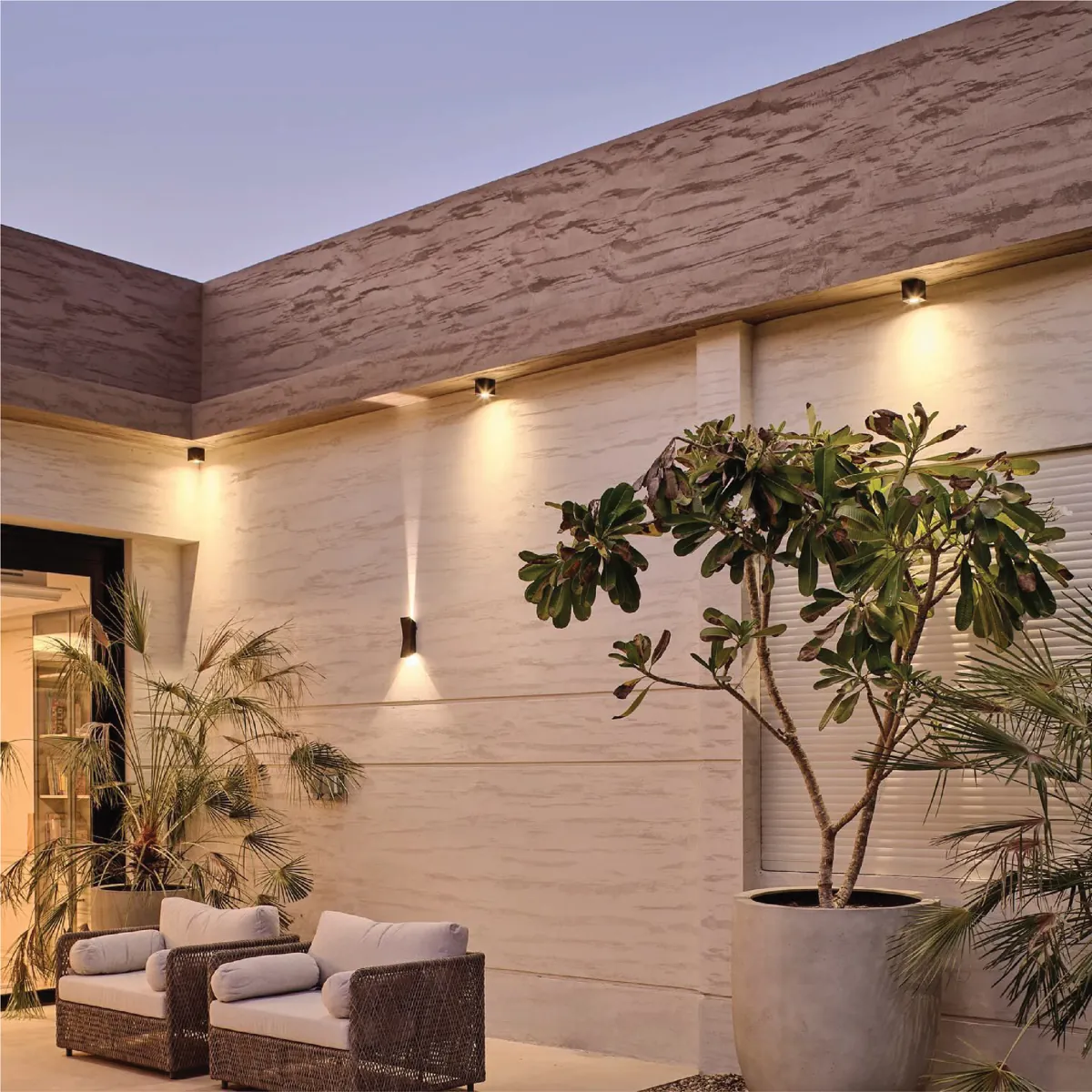 Covered terrace with wall lighting